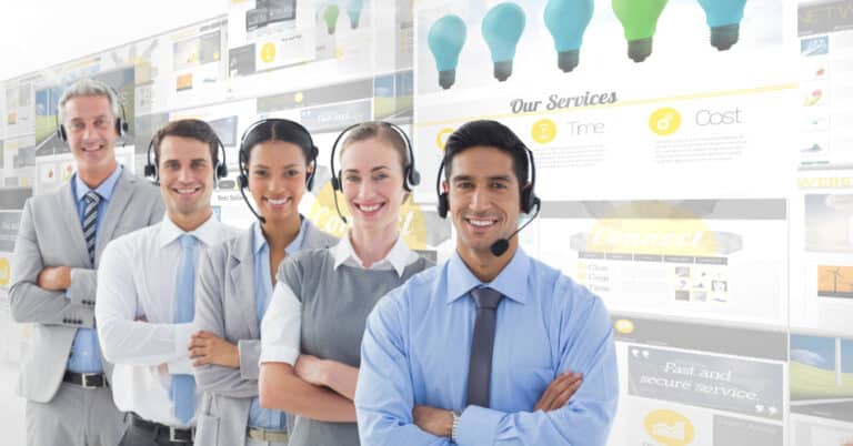 a group of people wearing headsets standing in front of a wall